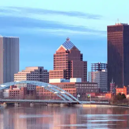 Cityscape with tall buildings and a river